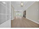 Spacious living room with hardwood floors and stone fireplace feature at 2515 Saint Andrews Dr., Little River, SC 29566