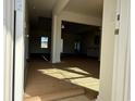 View from entry showcasing the spacious living area with natural light and neutral paint at 1009 Jase Dr., Longs, SC 29568