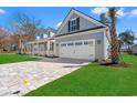 Spacious two-car garage with a brick paver driveway at 1101 Anne St., North Myrtle Beach, SC 29582