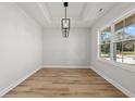 Bright room featuring luxury vinyl plank flooring and modern lighting at 1101 Anne St., North Myrtle Beach, SC 29582