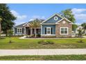 Charming home with stone and siding accents, complemented by lush landscaping and a walkway at 1201 Surf Pointe Dr., North Myrtle Beach, SC 29582