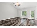 Bright and airy living room with large windows and hardwood flooring at 197 Six Mile Creek Dr., Georgetown, SC 29440