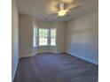 Cozy bedroom featuring a large bay window, plush carpeting, and a neutral color scheme at 2770 Daisy Rd., Loris, SC 29569