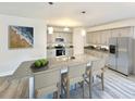 Modern kitchen featuring stainless steel appliances, granite countertops, and a large island with seating at 2808 Daisy Rd., Loris, SC 29569