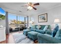 Bright living room with access to a private balcony and scenic views at 597 Blue River Ct. # 2F, Myrtle Beach, SC 29579