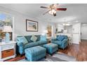 Relaxing living room featuring comfy teal sofas and coastal decor at 597 Blue River Ct. # 2F, Myrtle Beach, SC 29579