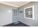Inviting condo entry with private door and window at 2405 S Ocean Blvd. # 207, North Myrtle Beach, SC 29582