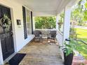 Cozy front porch with seating, offering a comfortable space to unwind and enjoy the neighborhood at 306 E Godbold St., Marion, SC 29571
