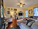 Cozy living room with hardwood floors, ceiling fan and lots of natural light at 306 E Godbold St., Marion, SC 29571