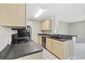 Bright kitchen with stainless steel appliances and white tile flooring at 8830 Chandler Dr. # E, Myrtle Beach, SC 29575