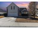 Charming brick home with two-car garage at sunset at 1133 Spalding Ct., Surfside Beach, SC 29575