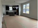 Open concept dining area with dark kitchen cabinets and island visible at 1241 Crested Iris Way, North Myrtle Beach, SC 29582