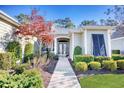 Close up of a home's inviting front entrance and the professionally landscaped walkway leading to the front door at 190 Sugar Loaf Ln., Murrells Inlet, SC 29576