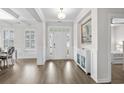 Inviting foyer with hardwood floors, stylish decor, and access to a bright, airy bedroom at 3126 White Jasmine Dr., Little River, SC 29566