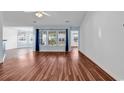 Spacious living room featuring hardwood floors, large windows, and natural light at 784 Riverward Dr., Myrtle Beach, SC 29588
