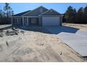 Newly built house featuring a two-car garage and neutral exterior at Tbd 4 Mineral Springs Rd., Conway, SC 29527