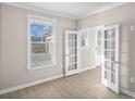 Light-filled office space featuring stylish French doors and a view of the outdoors at 377 Starlit Way, Myrtle Beach, SC 29579