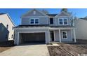 Two-story house with gray siding, attached garage, and landscaping at 3080 Palma Way, Myrtle Beach, SC 29579