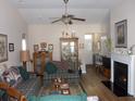 Spacious living room with high ceilings, wood floors, fireplace, and comfortable seating at 741 Londonberry Ct., Conway, SC 29526