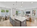 Spacious kitchen featuring a large island, stainless steel appliances, and an adjacent dining area at 2400 Hillbourne Loop, North Myrtle Beach, SC 29582