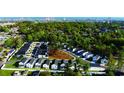Aerial view of a new construction neighborhood with tree lined streets and distant ocean view at 2628 Hillbourne Loop, North Myrtle Beach, SC 29582