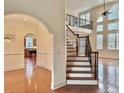 Inviting foyer with staircase and wood floors, offering a view into the dining area at 1038 Johnston Dr., Myrtle Beach, SC 29588