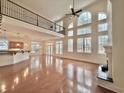 Bright living room with hardwood floors, fireplace, and large windows at 1038 Johnston Dr., Myrtle Beach, SC 29588