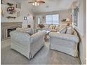 Inviting living room featuring a fireplace, comfortable seating, and large windows for natural light at 2707 Wood Creek Ln., Conway, SC 29527