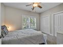 Cozy bedroom with natural light, neutral colors, and ample closet space at 613 Lee Ave., Murrells Inlet, SC 29576