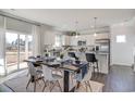 Open-concept kitchen with white cabinets, stainless steel appliances, granite countertops, and a dining area at 896 Agostino Dr., Myrtle Beach, SC 29579