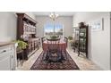 Cozy dining room featuring a window view, a decorative rug and traditional wooden furniture at 1004 Millsite Dr., Conway, SC 29526