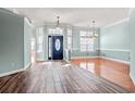 Bright and spacious living room with high ceilings, large windows, and stylish flooring at 126 Pickering Dr., Murrells Inlet, SC 29576