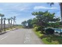 Parking area with ocean view and walkway access at 403 71St Ave. N # 1, Myrtle Beach, SC 29572