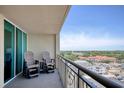 Enjoy a morning coffee on this spacious balcony with views of the city and neighborhood at 603 S Ocean Blvd. # 1002, North Myrtle Beach, SC 29582
