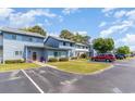 Charming townhomes with well-manicured lawns and assigned parking spaces, set under a beautiful blue sky at 775 Plantation Dr. # 59, Little River, SC 29566