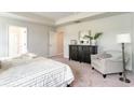 Comfortable main bedroom featuring a dresser, chair, and a large window at 531 Slaty Dr., Myrtle Beach, SC 29588