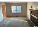 Living room with fireplace and large window at 807 Anne St., North Myrtle Beach, SC 29582