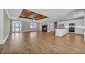 Open-concept floor plan showcases living space with fireplace and modern kitchen at 1151 Bear Lake Dr., Longs, SC 29568