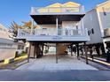 Charming raised beach house with spacious carport and dual balconies for relaxation at 6001 - 1045 S Kings Hwy., Myrtle Beach, SC 29575
