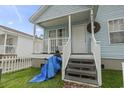 The home's front porch has classic railing with great curb appeal to the exterior at 815 Rogers Dr., Myrtle Beach, SC 29577
