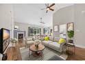 Comfortable living room boasting hardwood floors, a cozy fireplace, and a great view to the kitchen and dining area at 158 Regency Dr., Conway, SC 29526