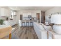 Open-concept living space featuring a modern kitchen with white cabinets, a center island, and eat-in counter at 503 Slaty Dr., Myrtle Beach, SC 29588