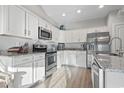 Well-equipped kitchen boasting stainless steel appliances, granite countertops and white cabinetry at 105 Villa Mar Dr. # C-3, Myrtle Beach, SC 29579