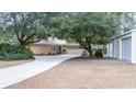 House exterior with long driveway and detached garage at 272 Old Ashley Loop, Pawleys Island, SC 29585