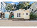 Inviting yellow cottage features a deck and nicely landscaped yard at 6001 - D07 S Kings Hwy., Myrtle Beach, SC 29575