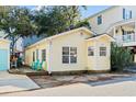 Cute yellow cottage with a deck and nicely landscaped yard at 6001 - D07 S Kings Hwy., Myrtle Beach, SC 29575