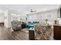 Spacious living room featuring an open layout, hardwood floors, and comfortable seating arrangement at 6550 Anterselva Dr., Myrtle Beach, SC 29572