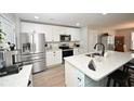 White cabinets, stainless steel appliances, and granite countertops at 865 Freestyle Ct., Longs, SC 29568