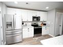 White cabinets, stainless steel appliances, and granite countertops at 865 Freestyle Ct., Longs, SC 29568