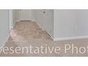 Hallway featuring carpet and vinyl flooring, and doors to other rooms in the home at 1530 Clubstone Dr., Conway, SC 29526